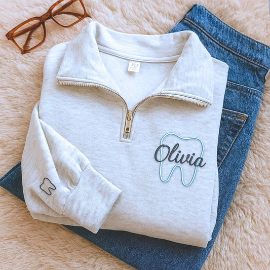 Personalized embroidered dentist sweatshirt with name on chest and dental text on sleeve