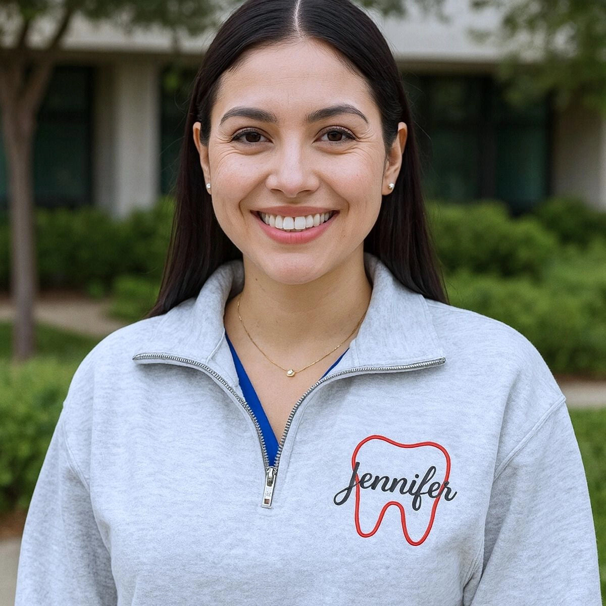 Personalized embroidered dentist sweatshirt with name on chest and dental text on sleeve