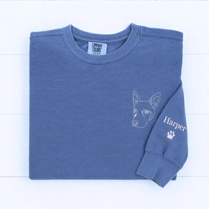 Custom embroidered sweatshirt featuring a realistic portrait of a Doberman dog with name on the sleeve
