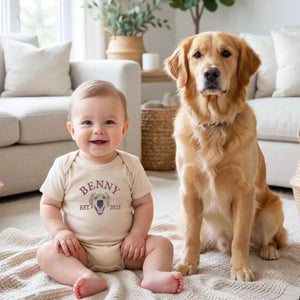 Baby wearing custom embroidered onesie with dog portrait for pregnancy announcement