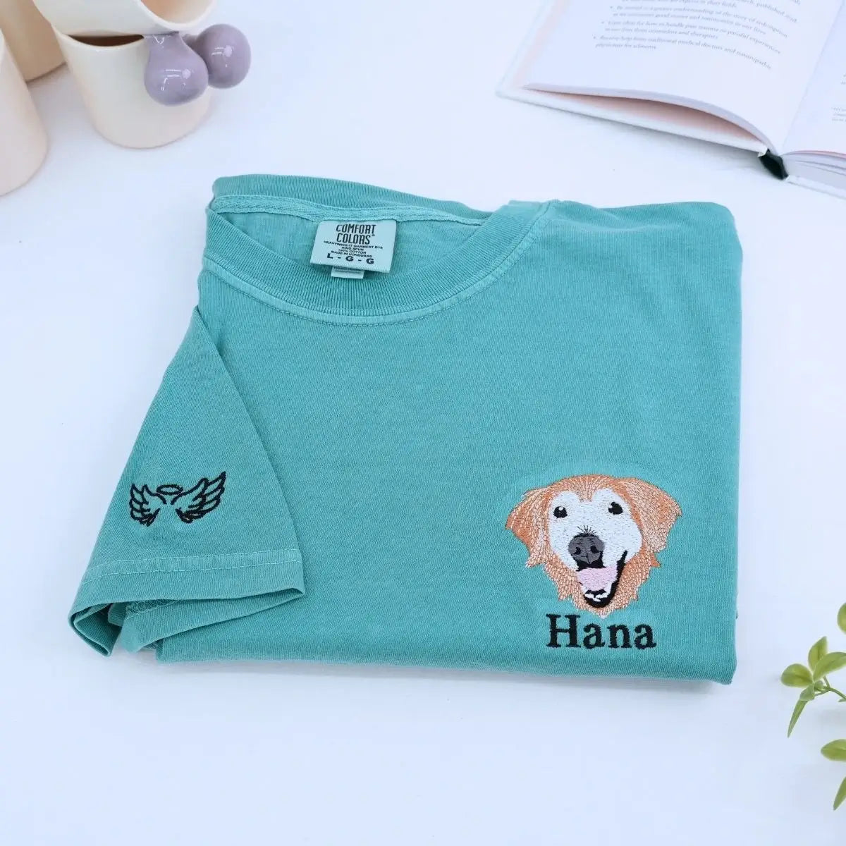 Close-up of custom embroidered dog cat portrait on a Comfort Colors® sweatshirt based on a customer photo