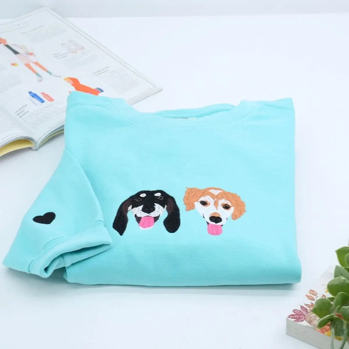 Close-up of custom embroidered dog cat portrait on a Comfort Colors® sweatshirt based on a customer photo