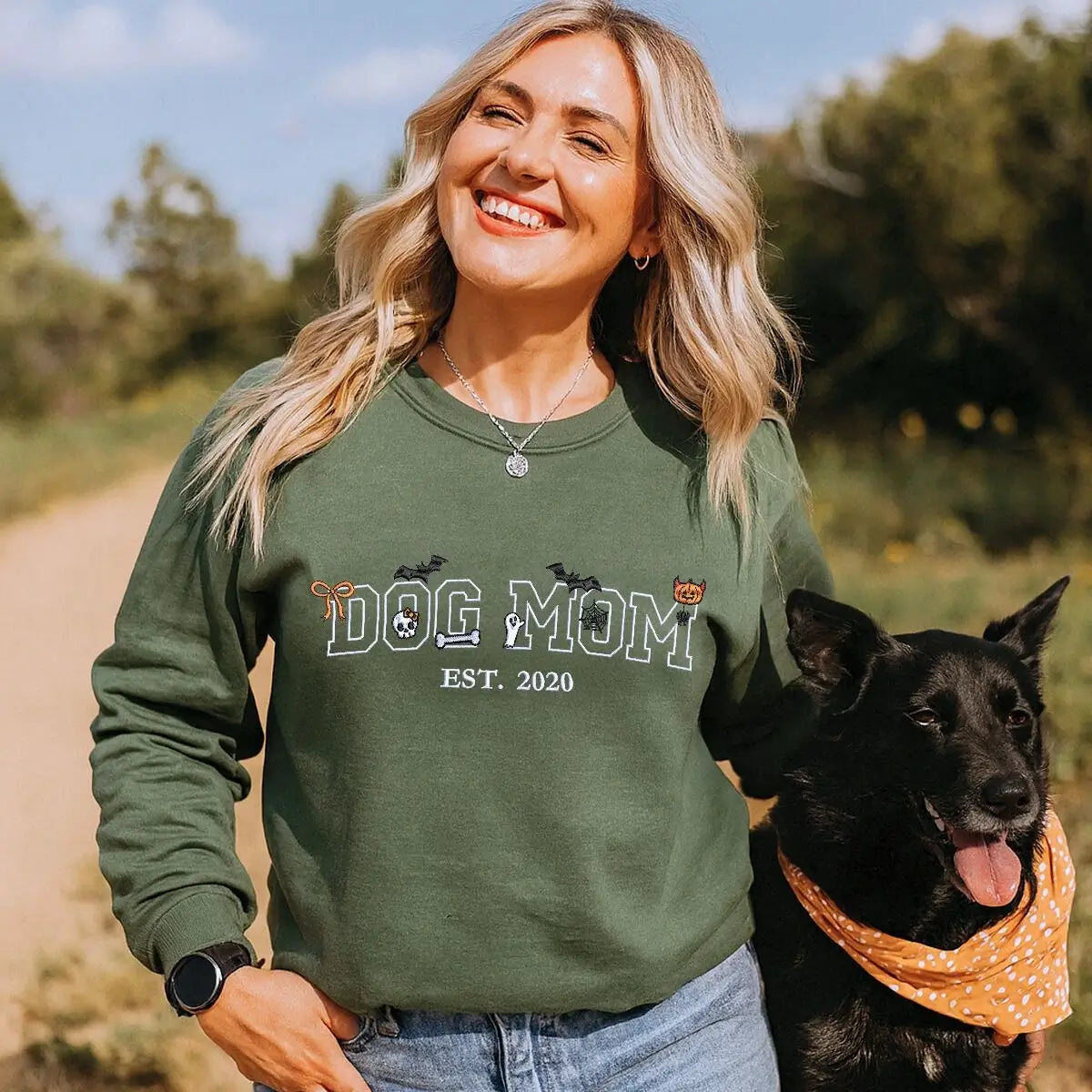 Custom embroidered Halloween sweatshirt for dog moms with cute pumpkin, ghost, and bones design around “Dog Mom” text
