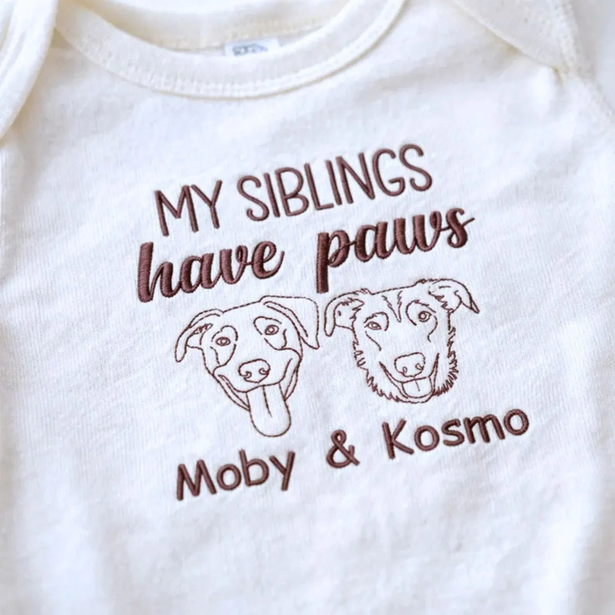 Personalized newborn baby onesie with embroidered dog portrait, soft cotton, ideal gift for pet-loving families