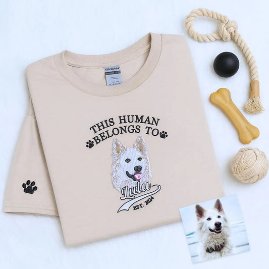 Custom embroidered shirt with pet dog portrait, name, and year on chest, personalized sleeve text