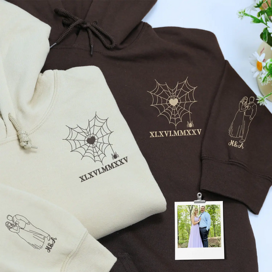 Custom embroidered couple hoodie with spider web design and personalized portrait on sleeve