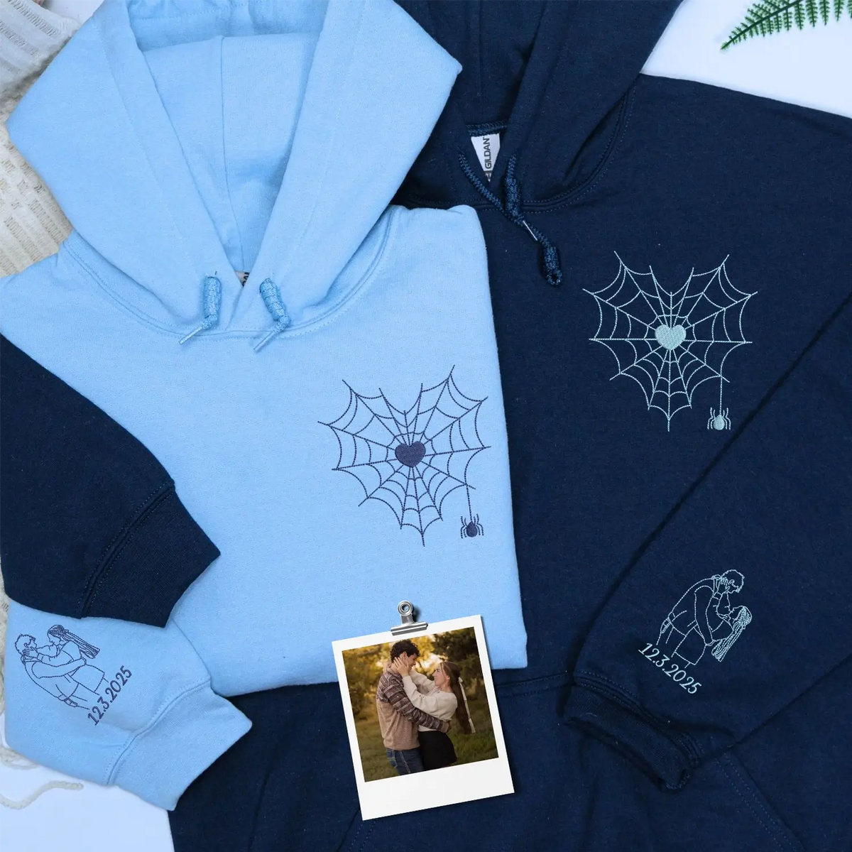 Custom embroidered couple hoodie with spider web design and personalized portrait on sleeve