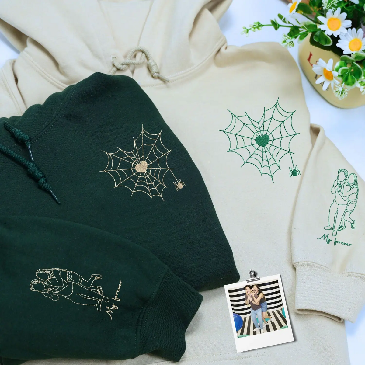 Custom embroidered couple hoodie with spider web design and personalized portrait on sleeve