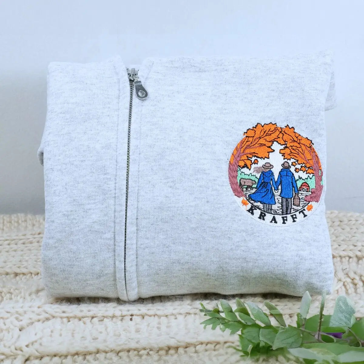 custom embroidered zip up hoodie with company logo on chest