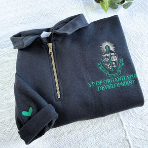 custom embroidered quarter zip sweatshirt with company logo on chest