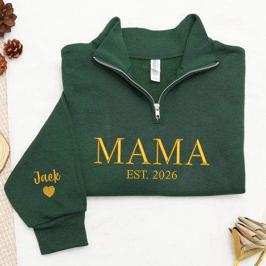 Green sweatshirt with 'MAMA EST. 2026' text on sleeve