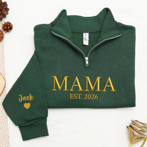 Green sweatshirt with 'MAMA EST. 2026' text on sleeve