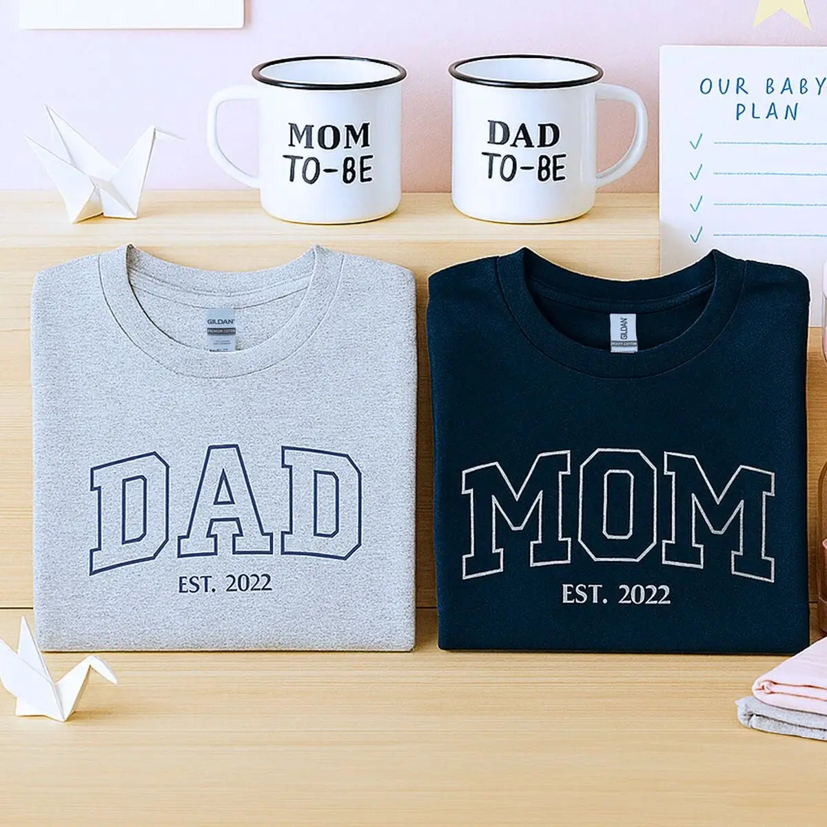 Custom embroidered mom and dad shirts with kid's name on sleeve and est. year