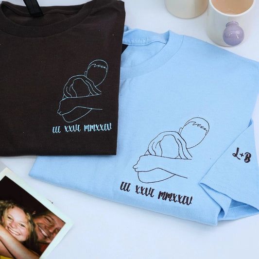 Custom embroidered portrait t-shirt featuring personalized couple photo in high-quality threads on light blue cotton shirt.