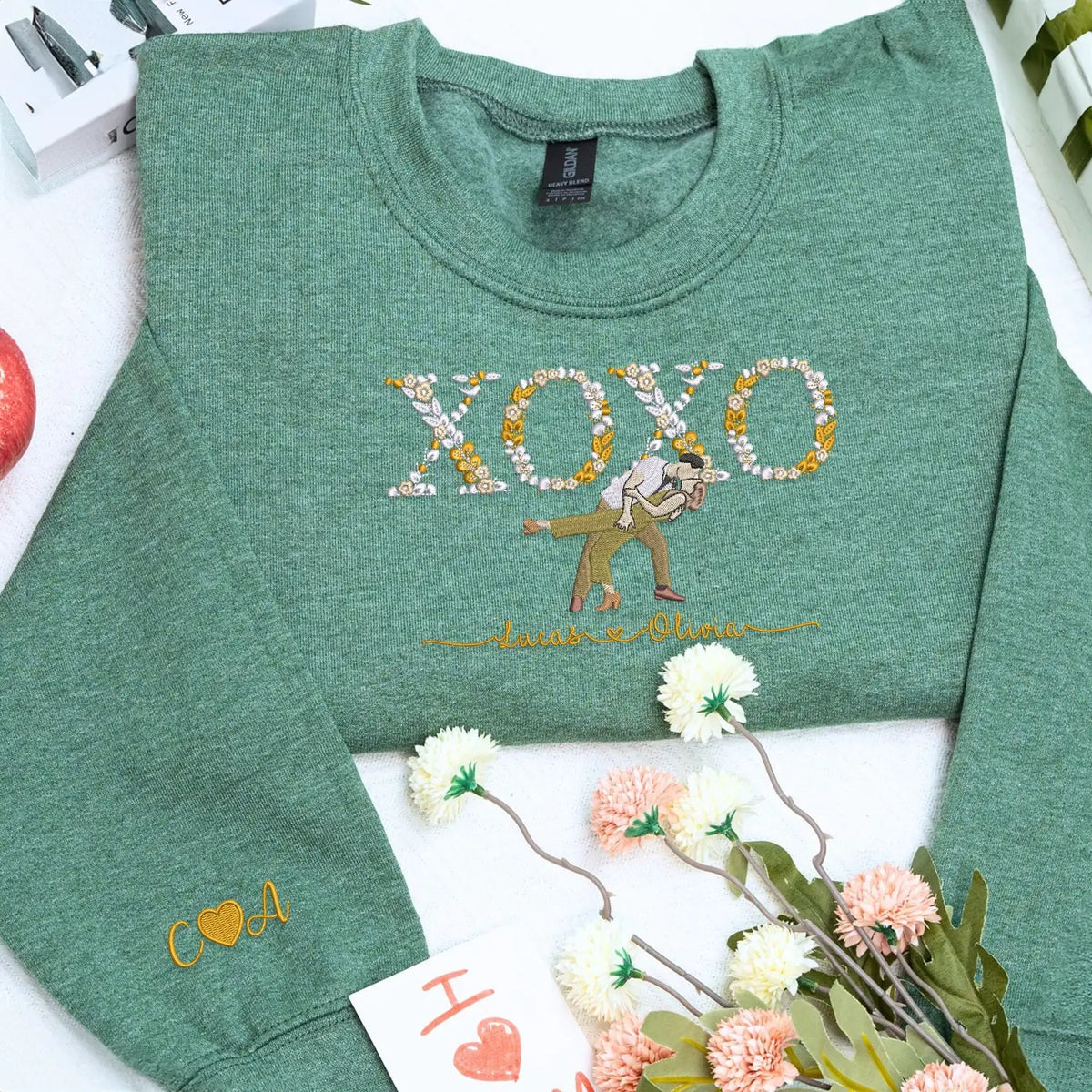 Custom embroidered portrait sweatshirt with floral XOXO design made from couple photo