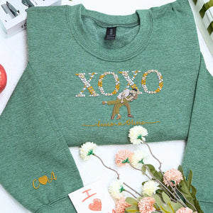 Custom embroidered portrait sweatshirt with floral XOXO design made from couple photo