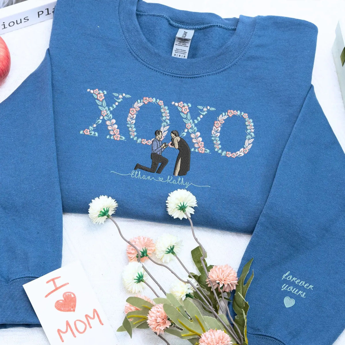 Custom embroidered portrait sweatshirt with floral XOXO design made from couple photo