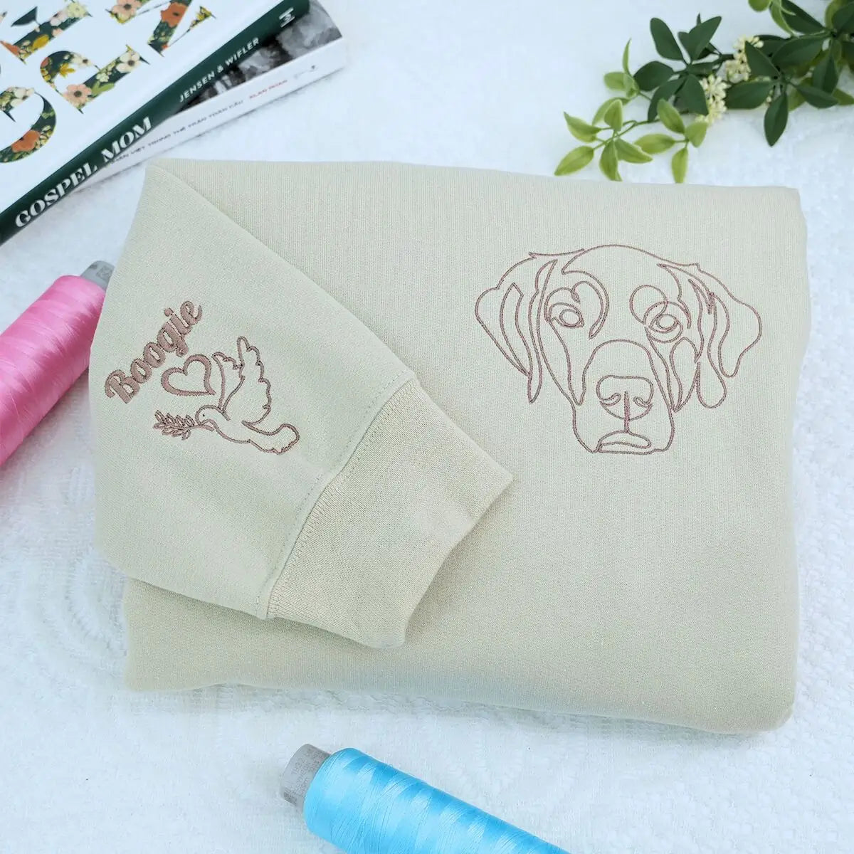 Custom embroidered sweatshirt with golden retriever portrait and personalized sleeve name