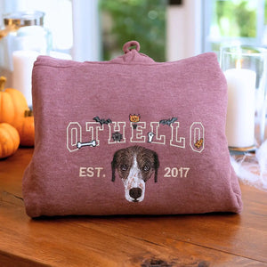 mbroidered custom Halloween hoodie with dog face, name, and spooky icons like bats and pumpkins