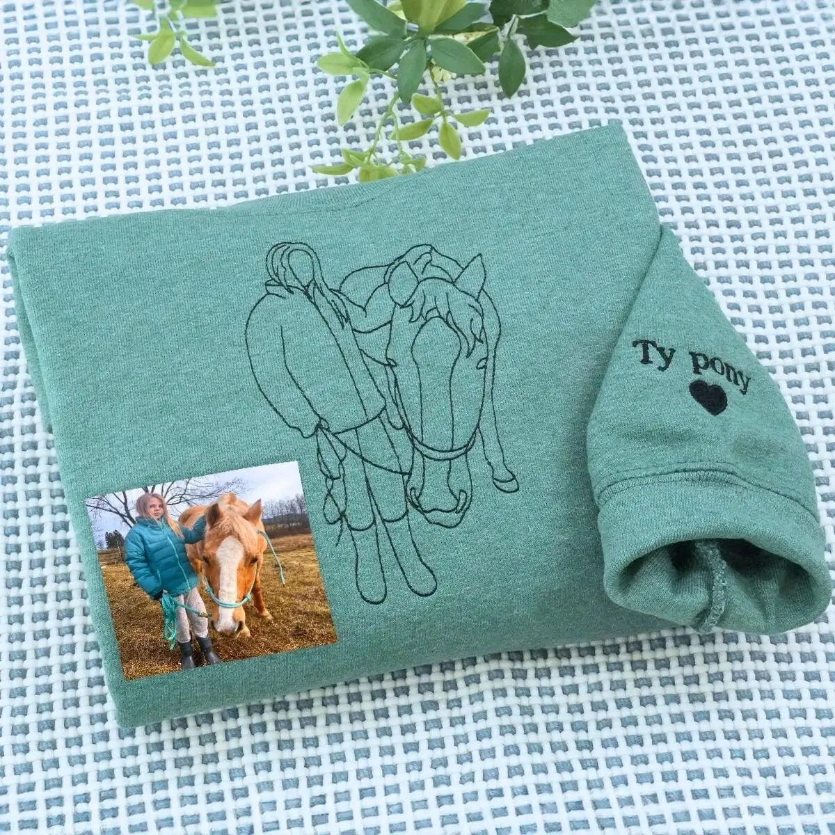 Custom embroidered sweatshirt with daughter's horse photo and heartfelt message from Mom and Dad