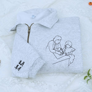 Custom embroidered quarter zip sweatshirt with company logo and text on sleeve, ideal for corporate team apparel.