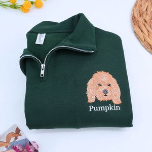 Custom embroidered quarter zip sweatshirt with company logo and text on sleeve, ideal for corporate team apparel.