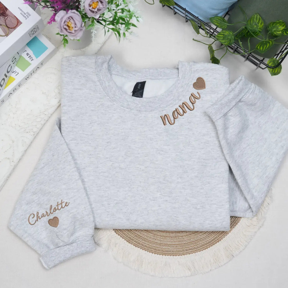 Custom Nana embroidered sweatshirt with heart on neckline and grandchild name on sleeve personalized grandma gift
