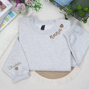 Custom Nana embroidered sweatshirt with heart on neckline and grandchild name on sleeve personalized grandma gift