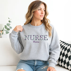 Personalized nurse sweatshirt with floral embroidery and name on chest – ideal Christmas gift for nurses