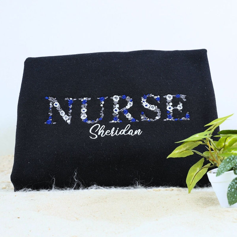 Personalized nurse sweatshirt with floral embroidery and name on chest – ideal Christmas gift for nurses
