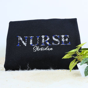 Personalized nurse sweatshirt with floral embroidery and name on chest – ideal Christmas gift for nurses