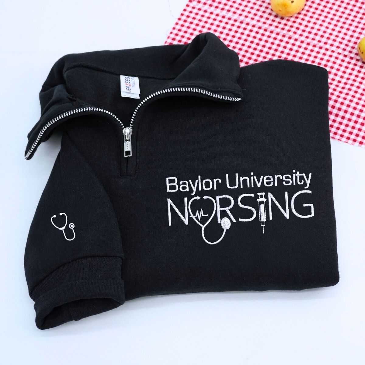 Custom embroidered nurse quarter zip sweatshirt with university name and personalized sleeve text
