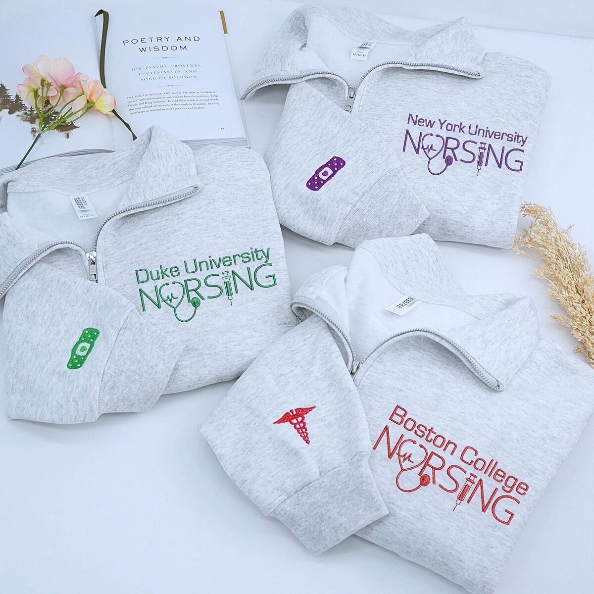 Custom embroidered nurse quarter zip sweatshirt with university name and personalized sleeve text