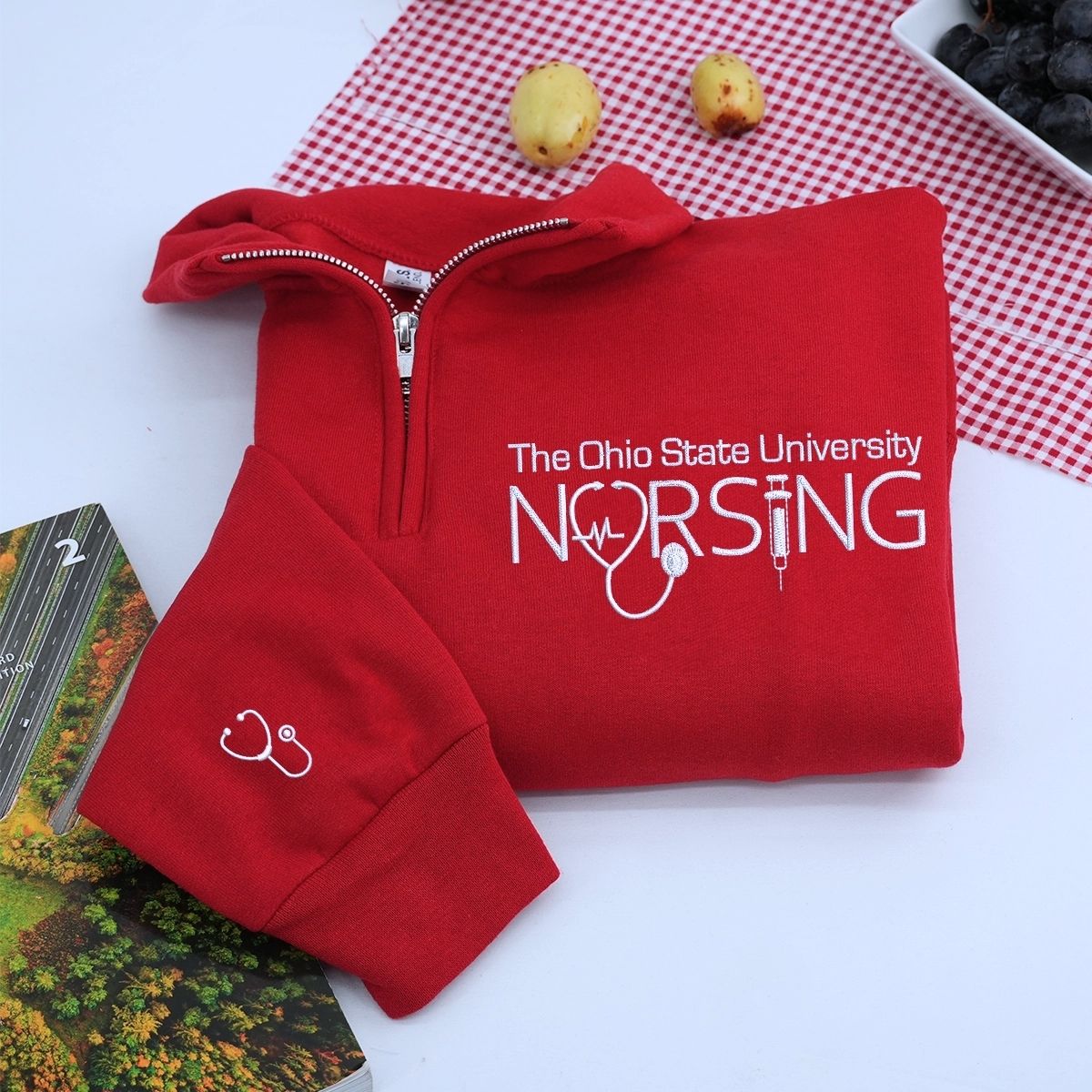 Custom embroidered nurse quarter zip sweatshirt with university name and personalized sleeve text