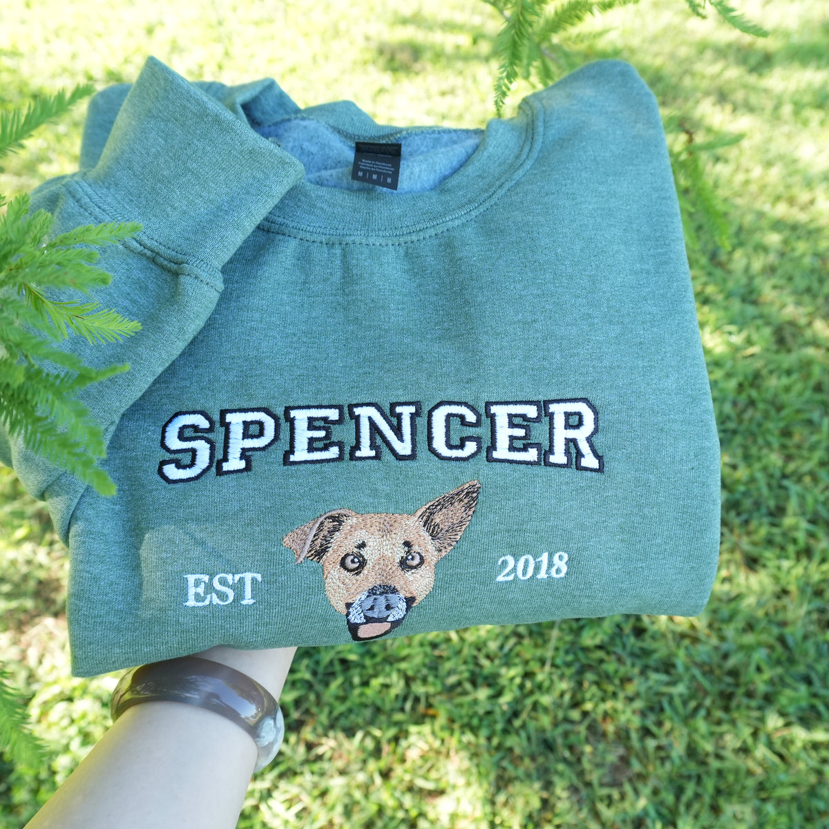 Custom embroidered hoodie with dog portrait stitched from uploaded photo