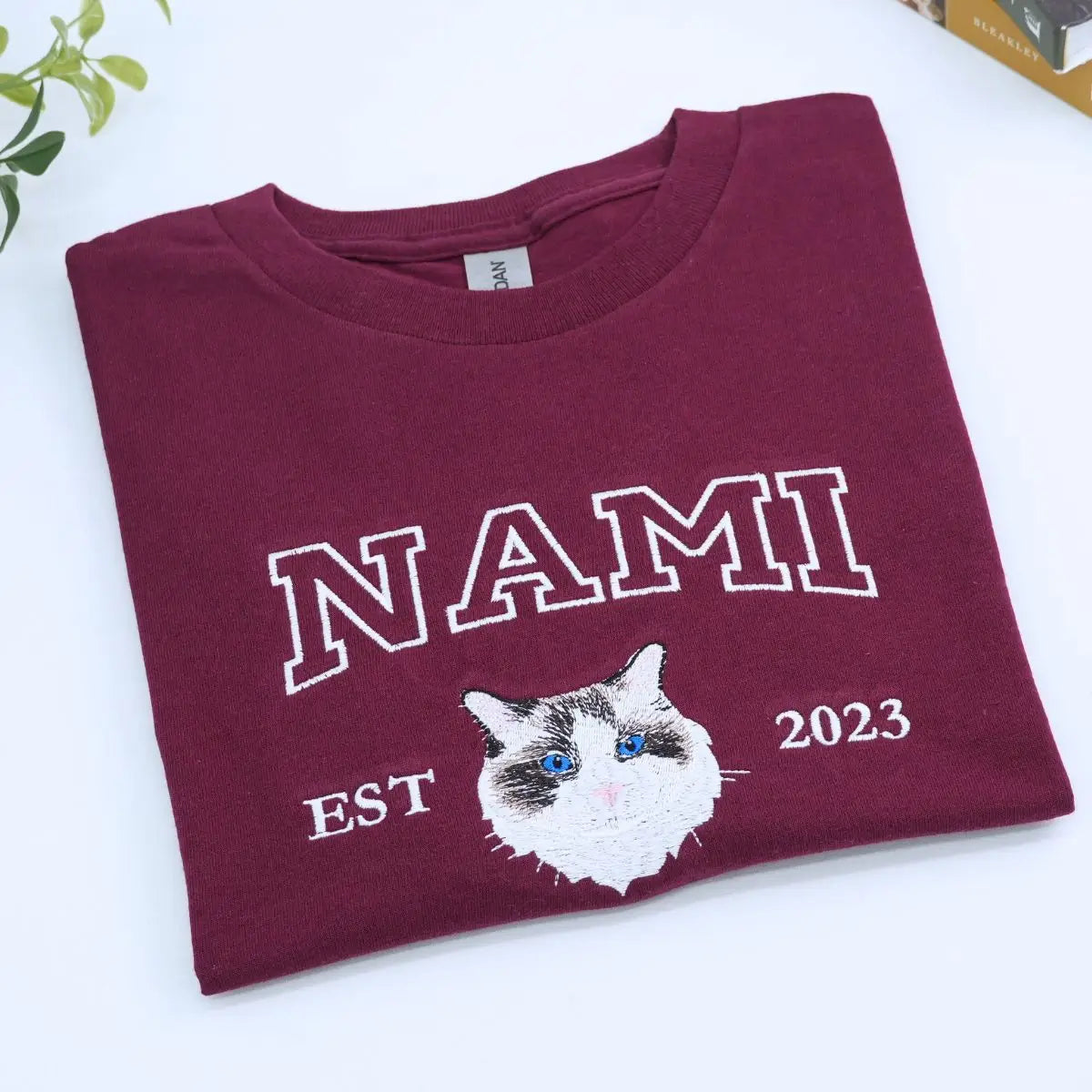 Custom white t-shirt with a embroidered cat dog face portrait, personalized from a customer photo