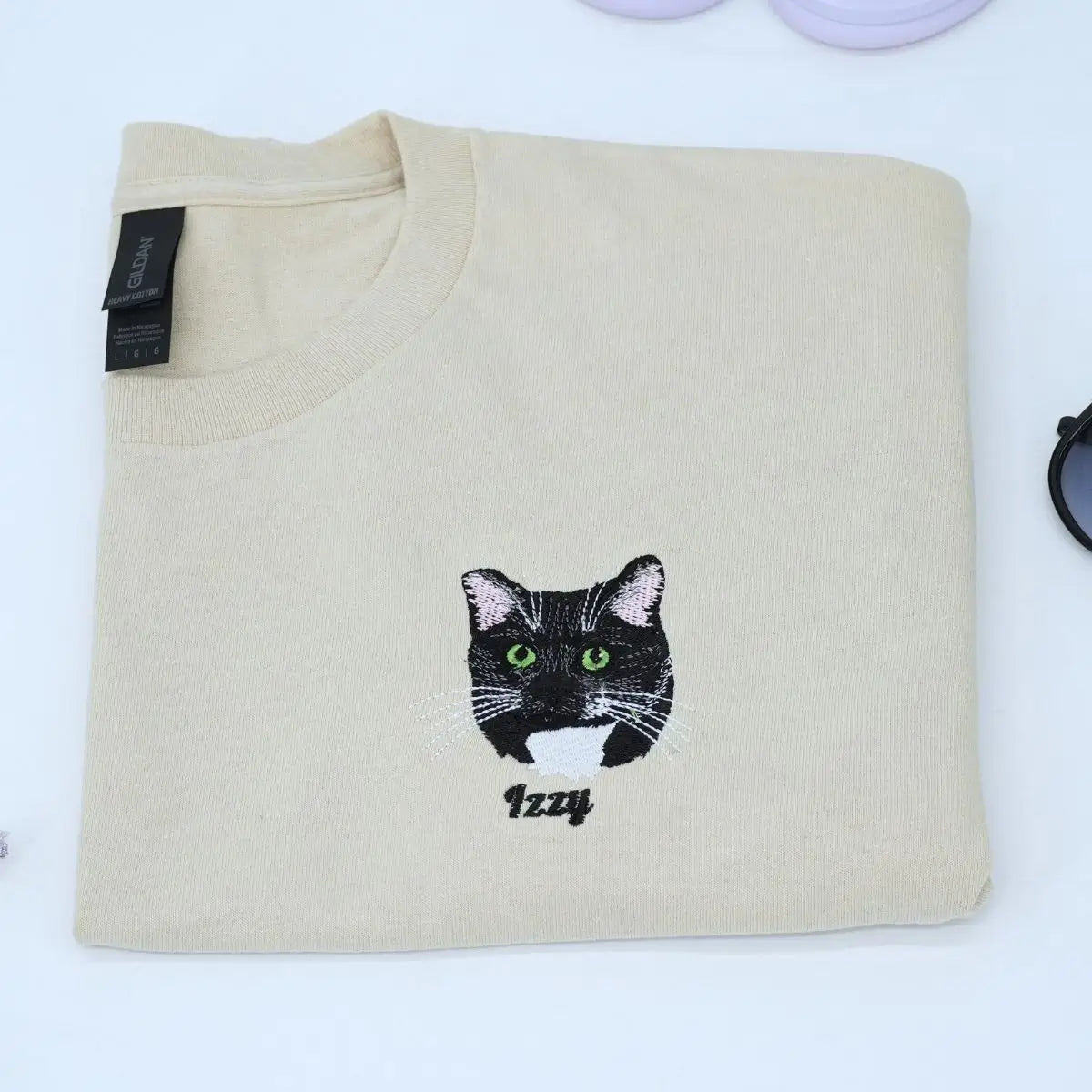 Custom white t-shirt with a embroidered cat dog face portrait, personalized from a customer photo
