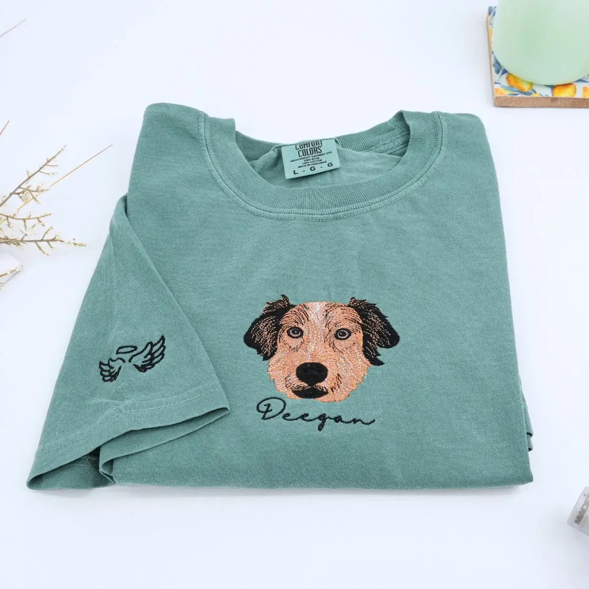 Custom white t-shirt with a embroidered cat dog face portrait, personalized from a customer photo