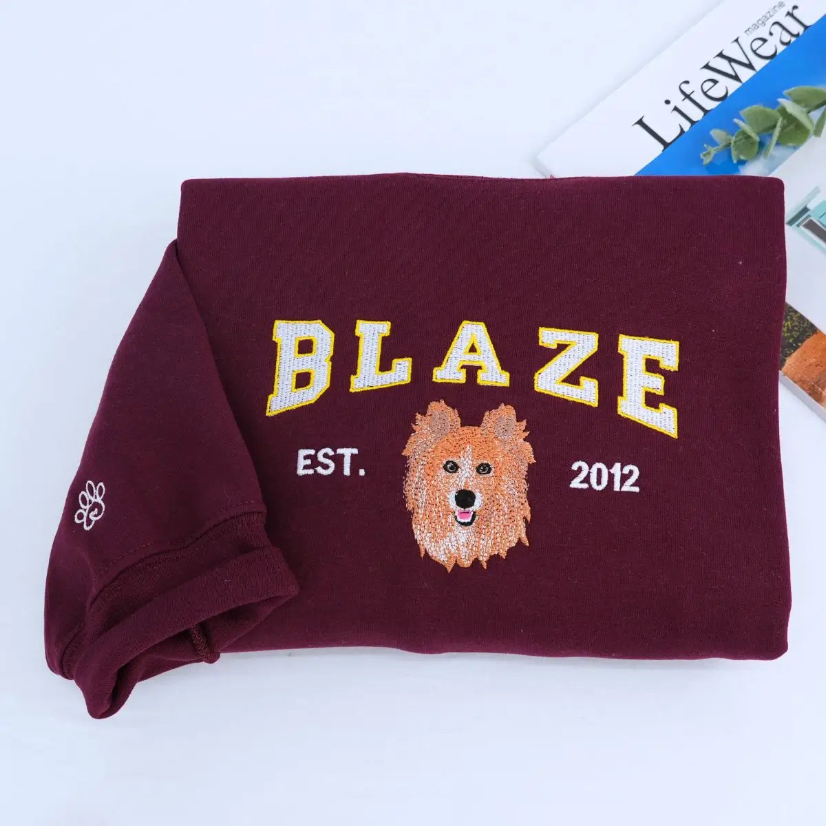 Custom embroidered shirt featuring Pomeranian portrait and name on sleeve