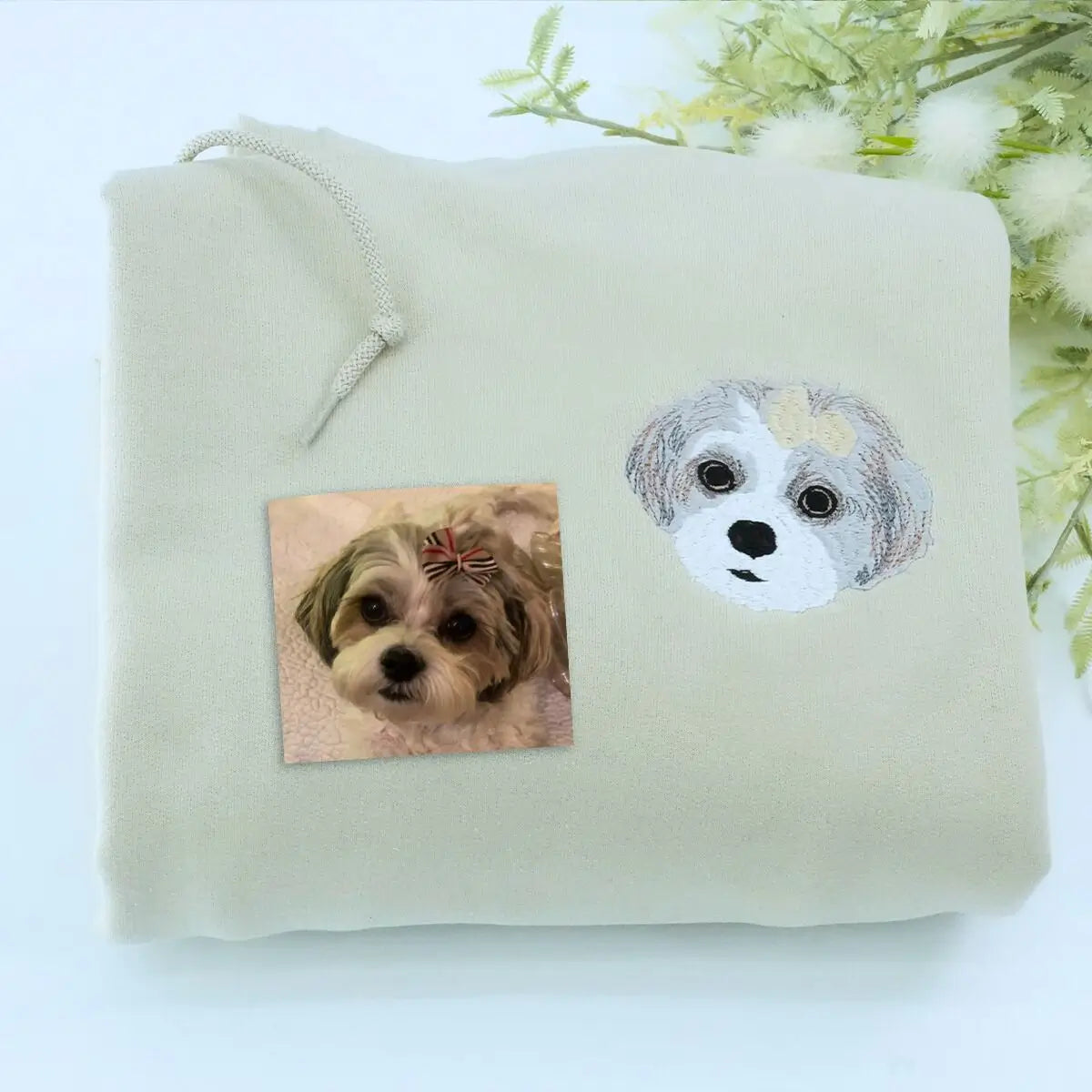 Embroidered hoodie featuring custom Shih Tzu portrait and name on sleeve