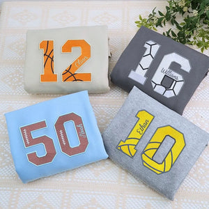 Custom embroidered sports hoodie with name and number, perfect personalized gift for fans, players, or proud parents.