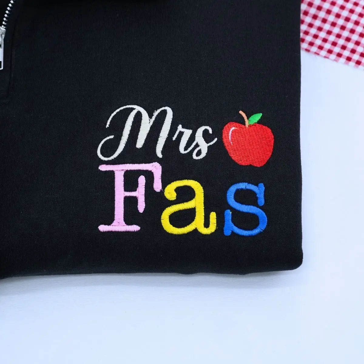 Custom embroidered teacher quarter zip sweatshirt with apple icon and personalized sleeve text