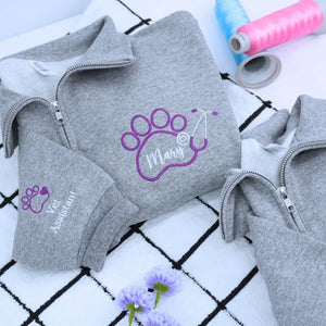 Custom embroidered quarter zip vet tech sweatshirt with personalized name and sleeve text