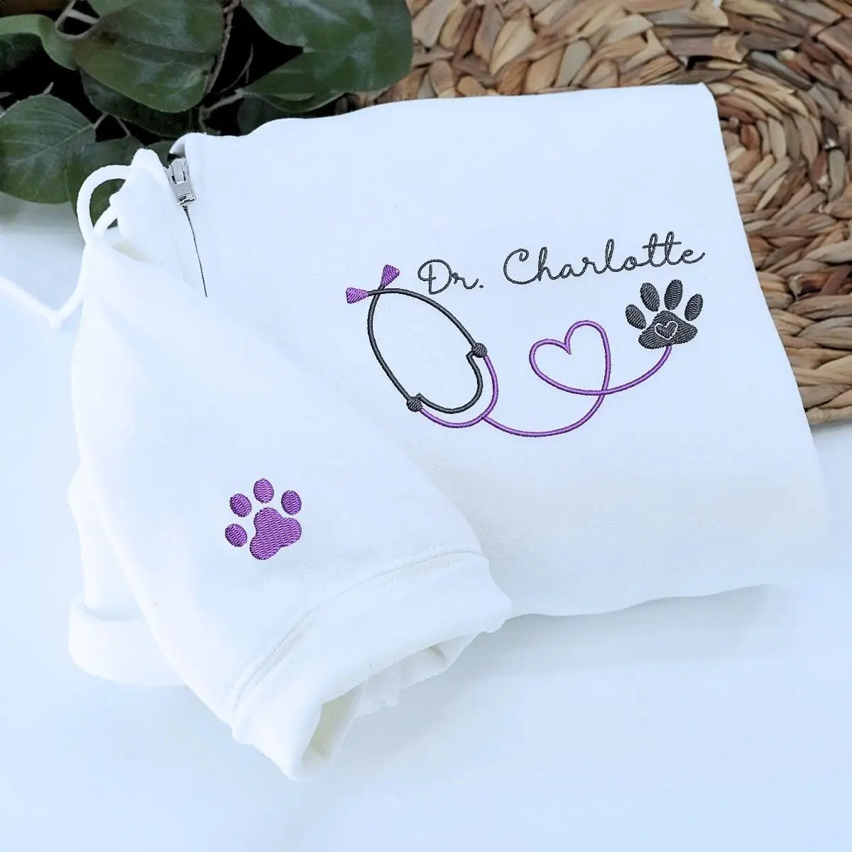 Custom embroidered vet tech quarter sweatshirt with name on chest and text on sleeve