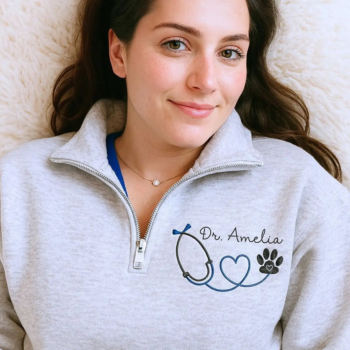 Custom embroidered vet tech quarter sweatshirt with name on chest and text on sleeve