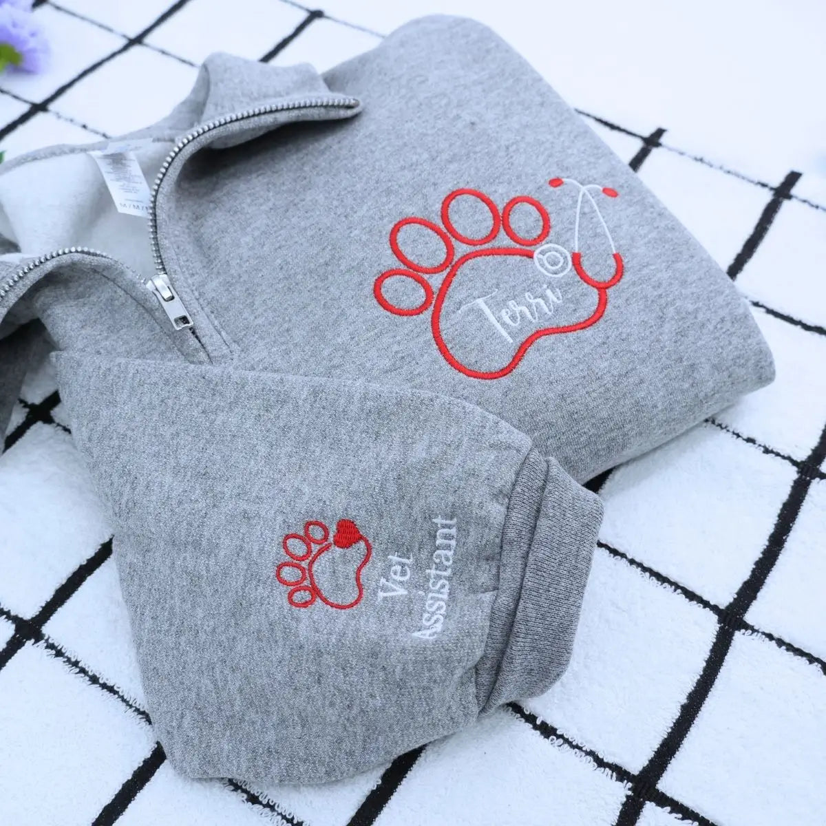 Custom embroidered quarter zip vet tech sweatshirt with personalized name and sleeve text