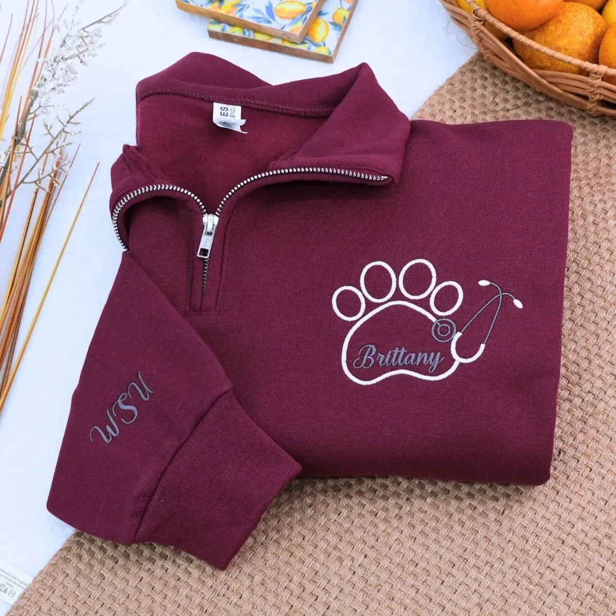 Custom embroidered quarter zip vet tech sweatshirt with personalized name and sleeve text