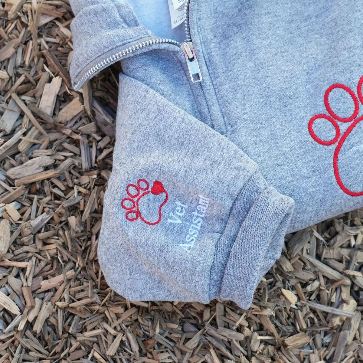 Custom embroidered quarter zip vet tech sweatshirt with personalized name and sleeve text