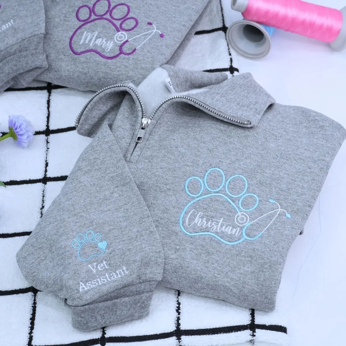 Custom embroidered quarter zip vet tech sweatshirt with personalized name and sleeve text