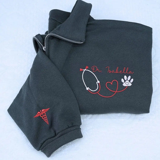 Custom embroidered vet tech quarter sweatshirt with name on chest and text on sleeve